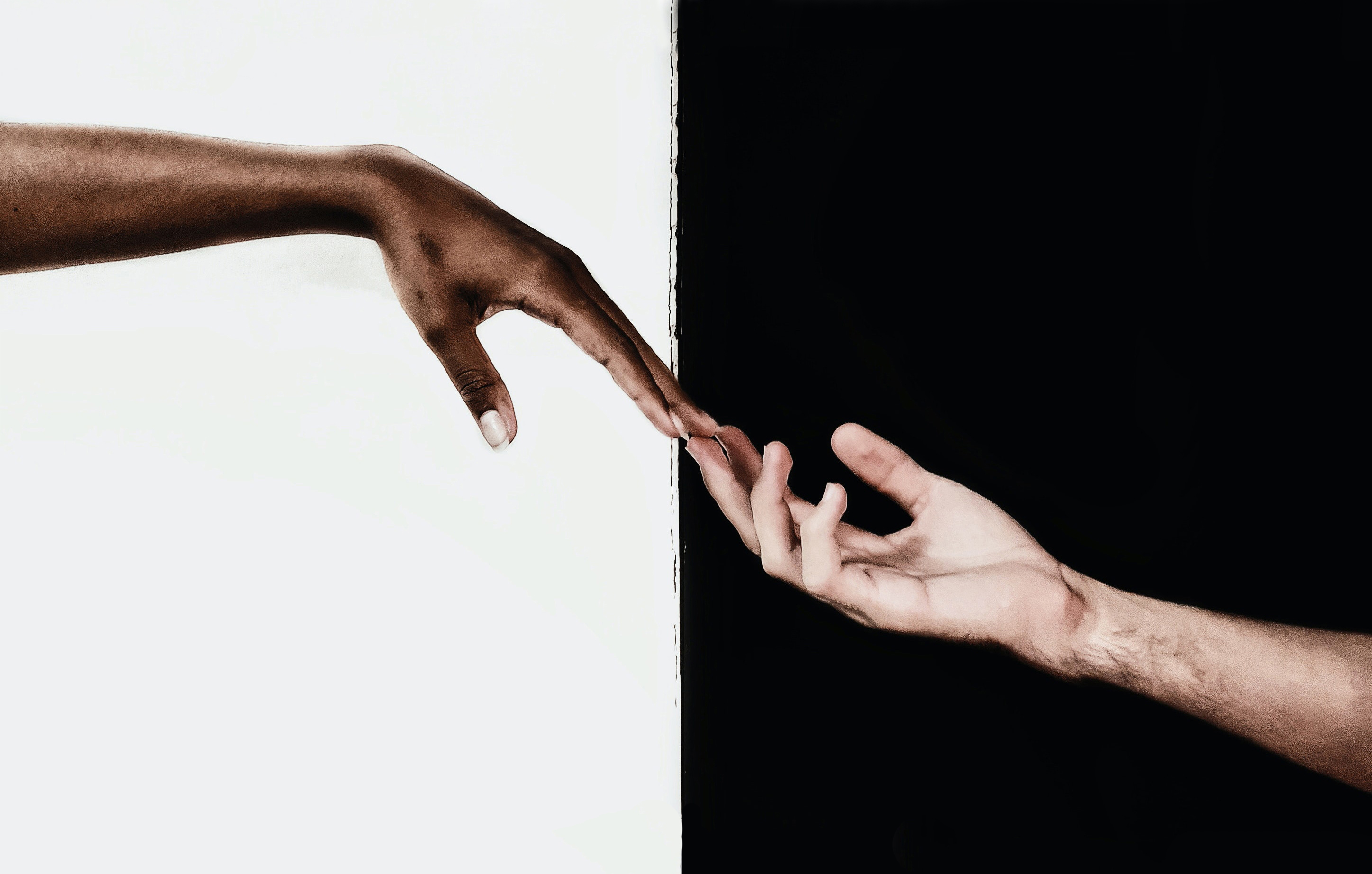 hands reaching out for one another